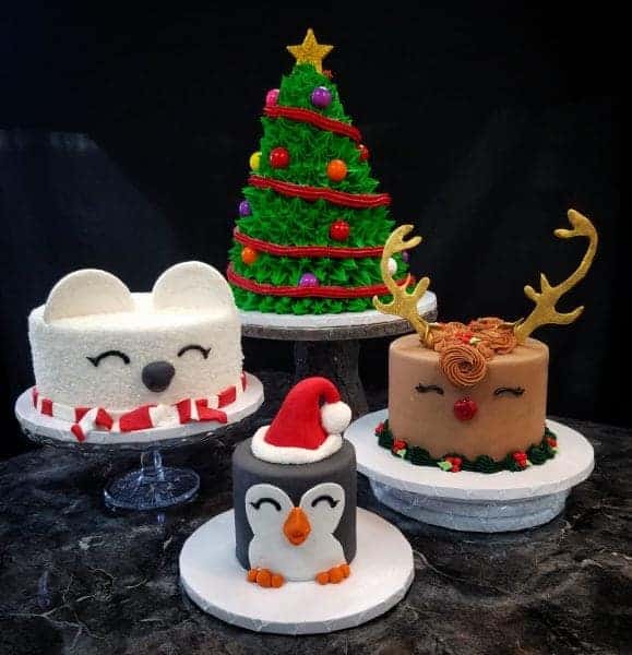 Holiday Cakes 4 different Cakes, a polar bear in a scarf, and penguin with a santa hat, and a red nosed reindeer