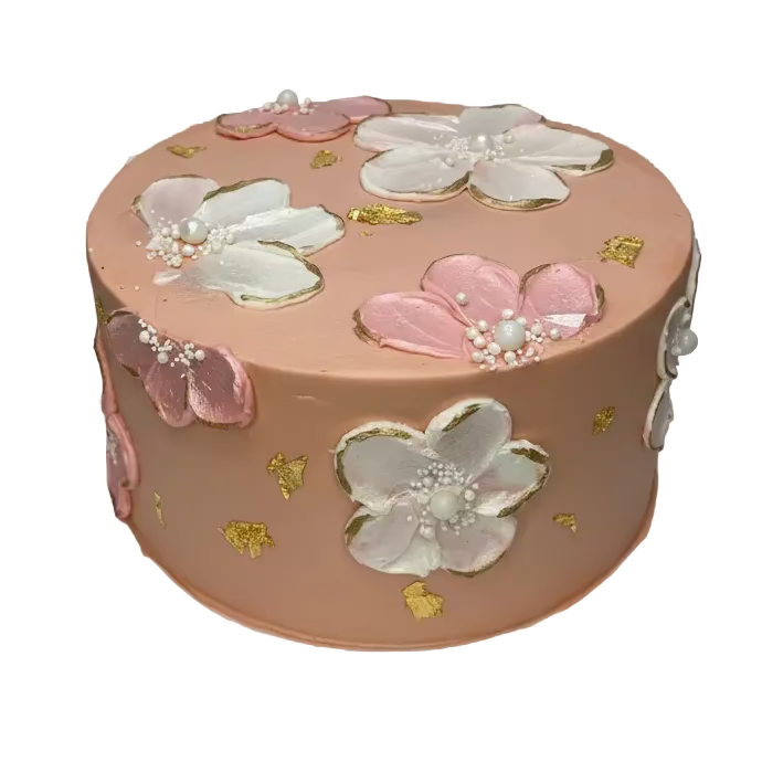 Decorative cake with floral designs on a white surface