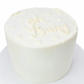 All white gender reveal cake with colored filling to match the baby's sex