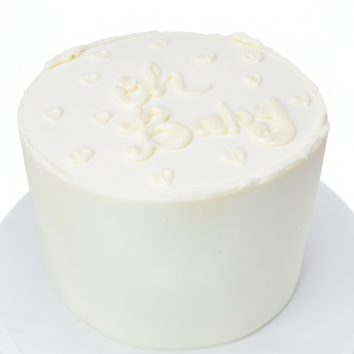 All white gender reveal cake with colored filling to match the baby's sex