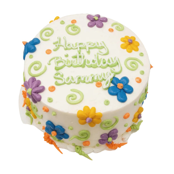 Birthday Cake with funky flowers (a piped a pedal flower), piped swirls, and dots