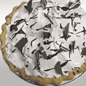 Chocolate cream pie with chocolate spikes, whipped topping and chocolate ganache