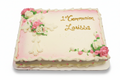 Decorative cake with pink flowers and '1st Communion Louissa' text on a white background