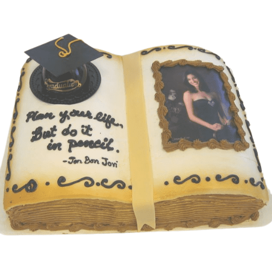 Graduation book cake with photo of the graduate, cap and quote