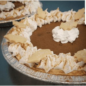 pumpkin pie with whip and leaves