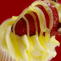Cupcake with a fresh strawberry and lemon topping
